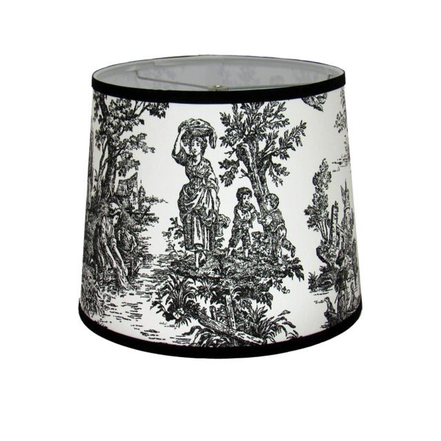 This black toile drum shade exudes timeless sophistication with its intricate pastoral design. The bold black pattern on a...