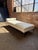 B&B Italia daybed designed by Antonio Citterio, upholstered in pristine white leather with a polished chrome base, made in...