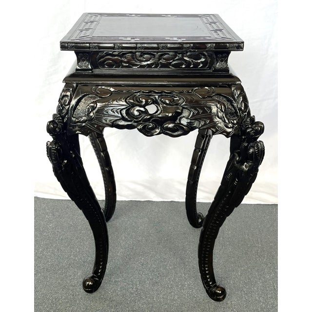 Beautiful and functional antique Asian jardiniere stand from the turn of the century. It's made of a hard rosewood and...