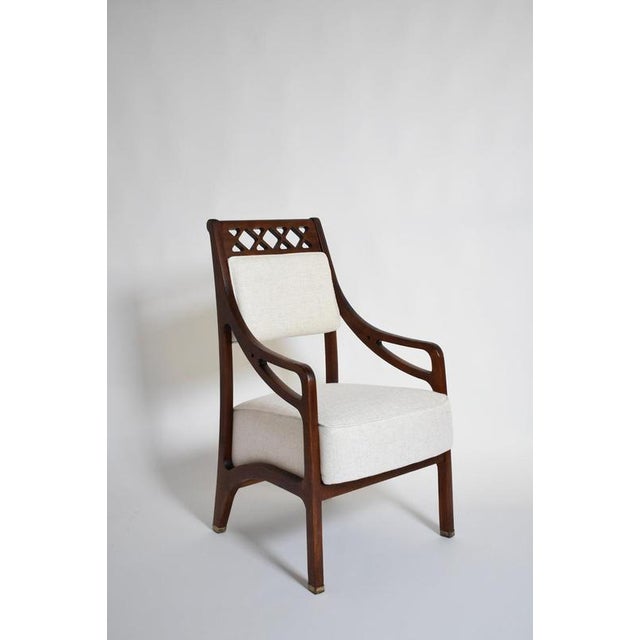 Pair of high back crosspieces armchairs, 1960s. Pair of high back crosspieces wooden armchairs. Italy, 1960s. Height: 100...