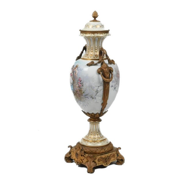 An Antique Large 19th-Century Sèvres-Style Scenic Urn is an exquisite piece, featuring vibrant porcelain with intricate...