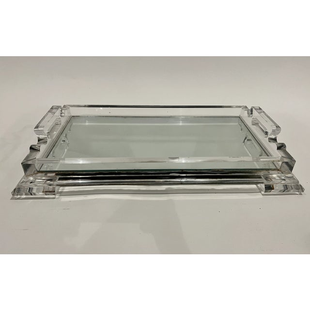 Magnificent Art Deco tray crafted of chunky lucite and mirror with decorative handles.