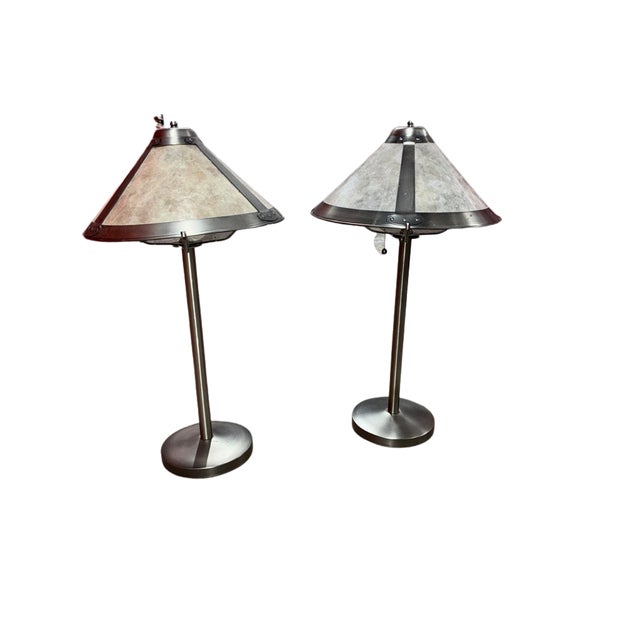 A striking pair of late-20th-century table lamps by Tensor Lighting, executed in brushed pewter-tone steel with wide...