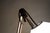 Clamp-on table lamp with painted metal frame and plastic shade. Model: Aggregato Designer: Enzo Mari Manufacturer:...