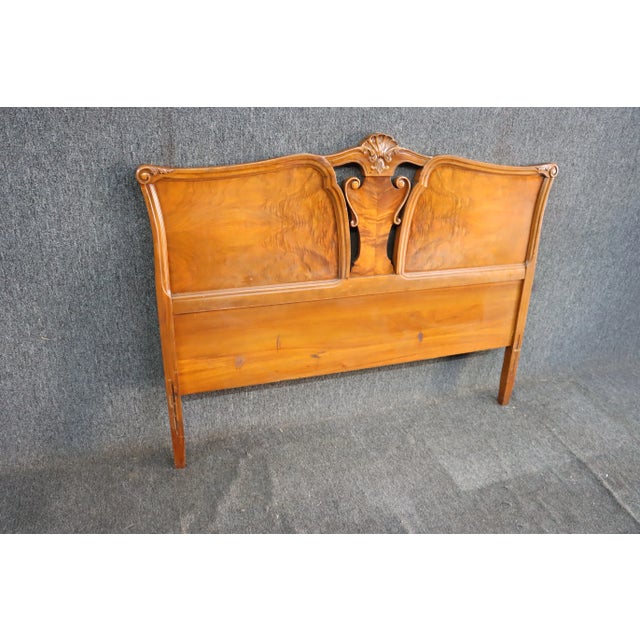 French style double headboard in Walnut with ornate carved details.