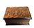 Vintage decorative box in embossed copper, featuring a lively medieval village dance scene, depicting characters in...