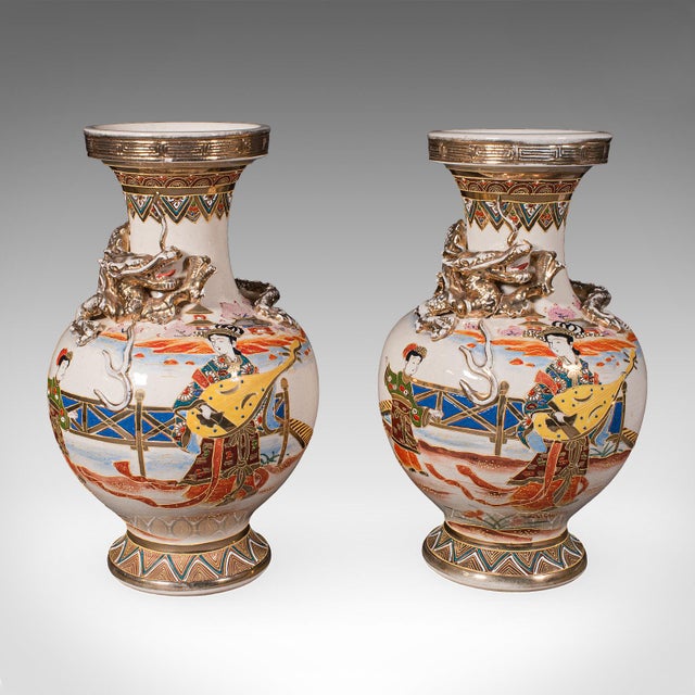 This is a pair of antique Satsuma vases. A Japanese, ceramic baluster urn, dating to the late Victorian period, circa...