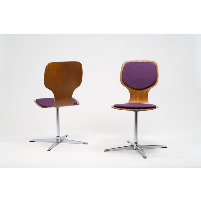 Beautifully designed swivel chairs with elegant seats made of thin plywood, manufactured in Germany in the late 1960s or...