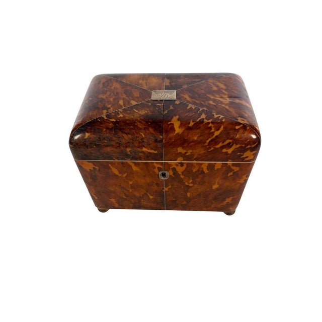 An exceptional early nineteenth-century faux tortoiseshell tea caddy of fine Georgian craftsmanship, presented in fabulous...