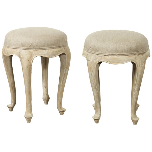 A pair of French Louis XV style walnut stools from the mid-20th century, with cabriole legs and new upholstery. Created in...