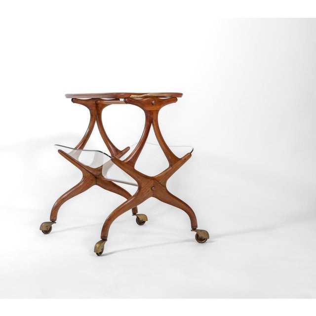 Mid Century Olivewood magazine rack bar cart trolley, almost certainly designed by Italian architect and designer Cesare...