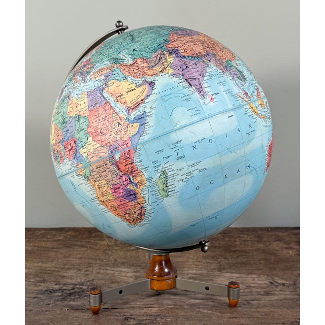 Vintage Replogle Stereo Relief globe featuring raised topography, original pastel political cartography, and a clean...