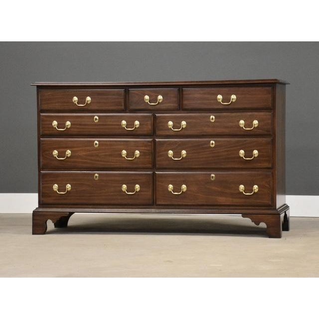 A nine drawer solid cherry dresser with brass bail pulls and dovetail drawers made by Harden. Excellent original...