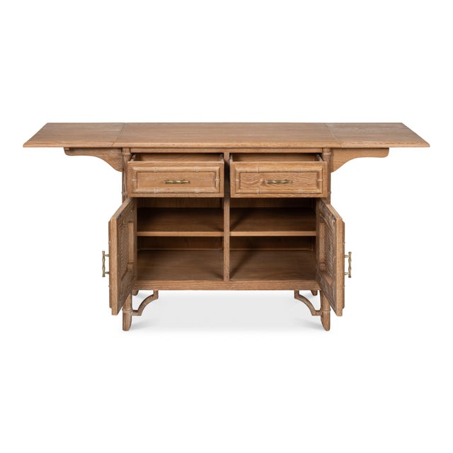 A hinged leaf at each end opens the serving surface well beyond the oak case below. Turned faux bamboo runs the corners....