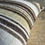 Creamy white hemp rug pillow with stripes. Soft hand, linen blend backing with zipper closure. Spot cleaning is...