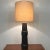 Large table lamp designed and made by Gordon Martz featuring a ceramic base with walnut accents. Original shade and...