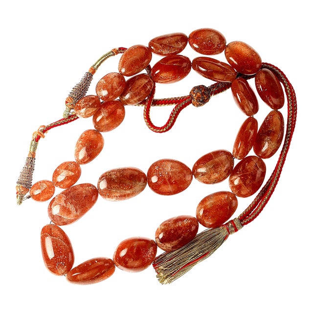 This is part of Chairish’s Costume Jewelry assortment. Description: Illuminate your style with this glorious African...