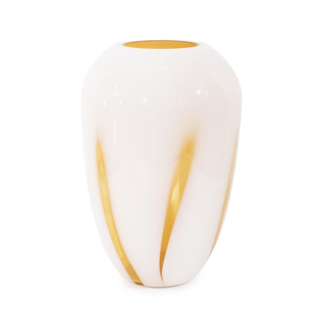 Our Grasberg Glass Vase in white with vibrant orange accents is a dazzling expression of contemporary design and artistic...