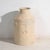 This set of two antique painted tin milk cans features two cylindrical containers with a narrowed upper neck, side handles...