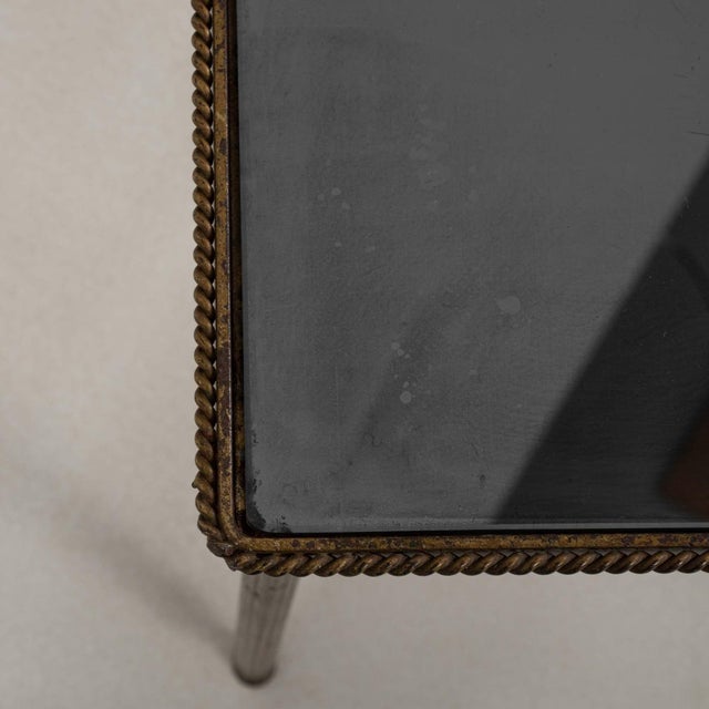 This piece presents as a table, distinguished by dark walnut, turned tapered. Originating in France during 1960s, it shows...