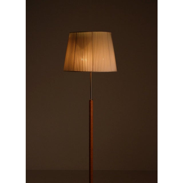 Designed by Josef Frank, model 2148, produced by Svenskt Tenn. with 4 lights each, controlled with two discreet push...