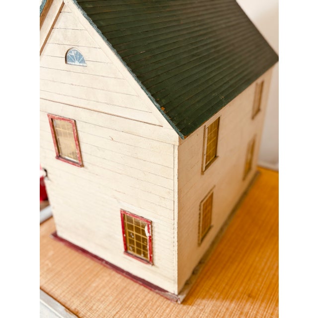 Charming early 20th-century American center-hall colonial dollhouse constructed of plywood and retaining an appealing old...
