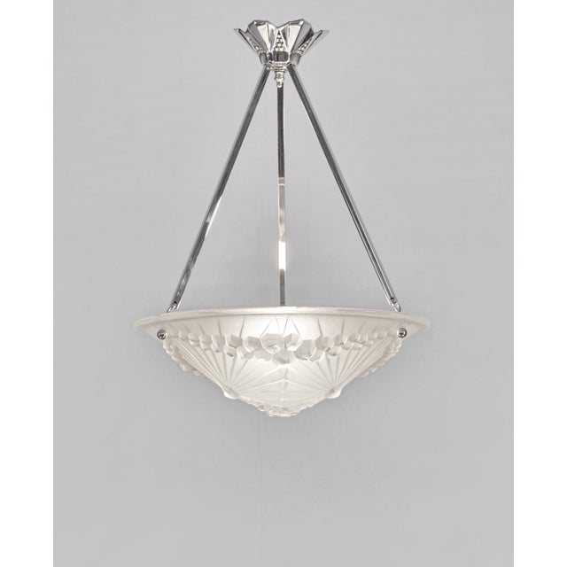 Charles Schneider & André Neut A beautiful French 1930 art deco pendant in nickel plated bronze or solid brass. It holds a...
