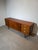 A beautifully balanced mid-century sideboard combining stunning rosewood doors with a warm teak frame, resulting in a rich...