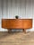 An elegant mid-century teak sideboard produced by Jentique in England during the 1960s, strongly influenced by...