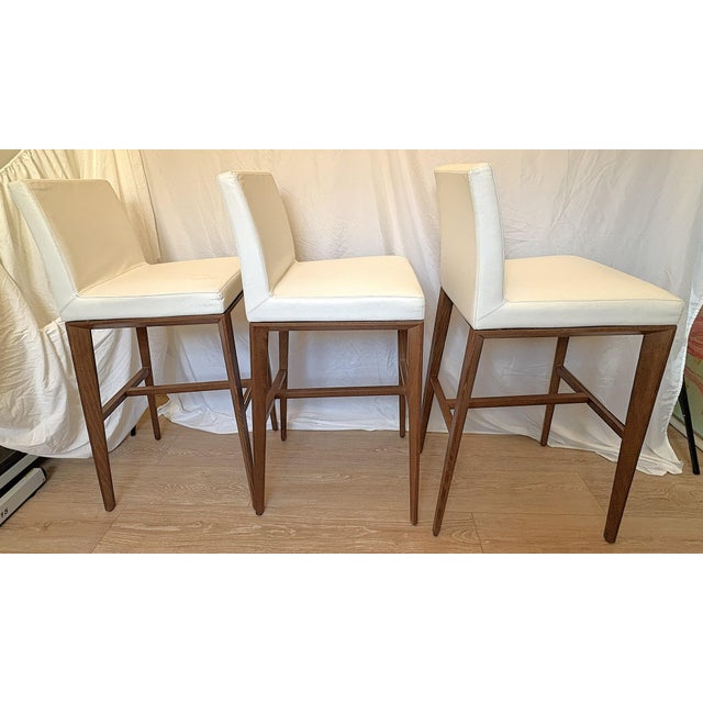 Pretty set of three pre-owned Calligaris 'Aida' barstools made in Italy. They have a refined minimalist style with sleek...