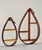 Vintage 1970s Danish modern teardrop bentwood hanging curio shelves. A coordinating pair in two sizes with a double...