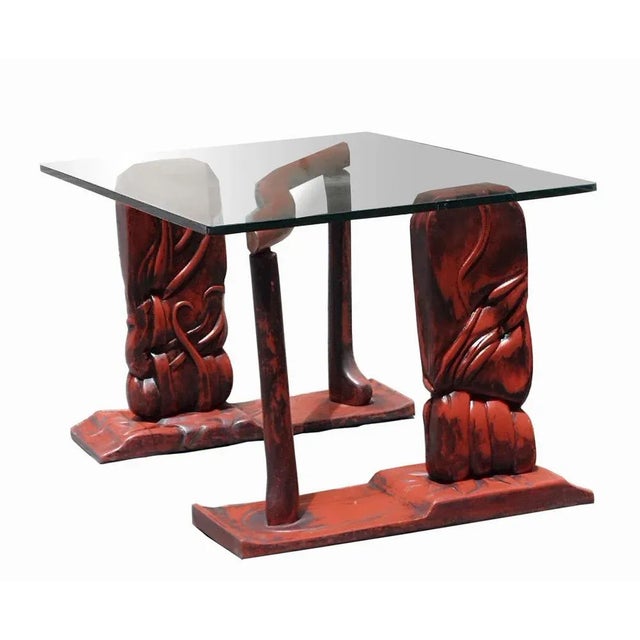 Coffee table with lacquered and hand-carved wood base with large rectangular glass top. Small defect on the glass