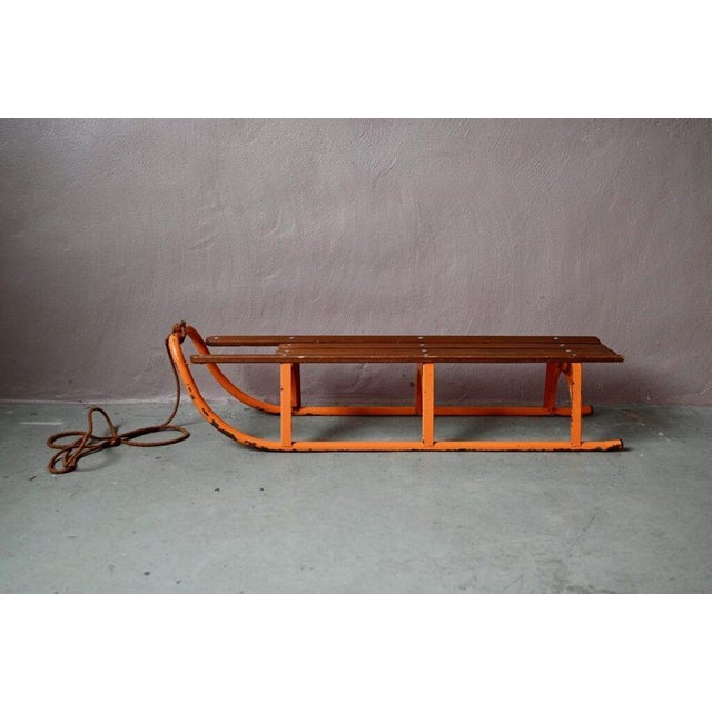 Here's a little sled that will bring back snowy memories for some! This charming vintage sled, made of wood and orange...
