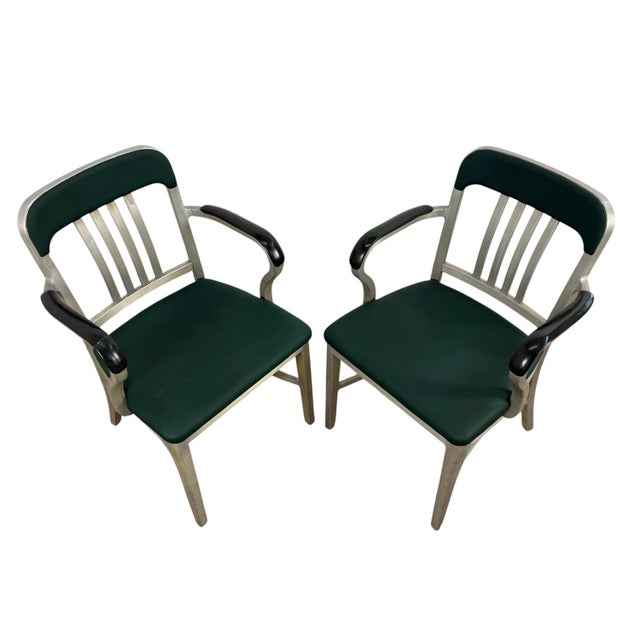 A rare and highly desirable pair of vintage GoodForm armchairs, manufactured by The General Fireproofing Company of...