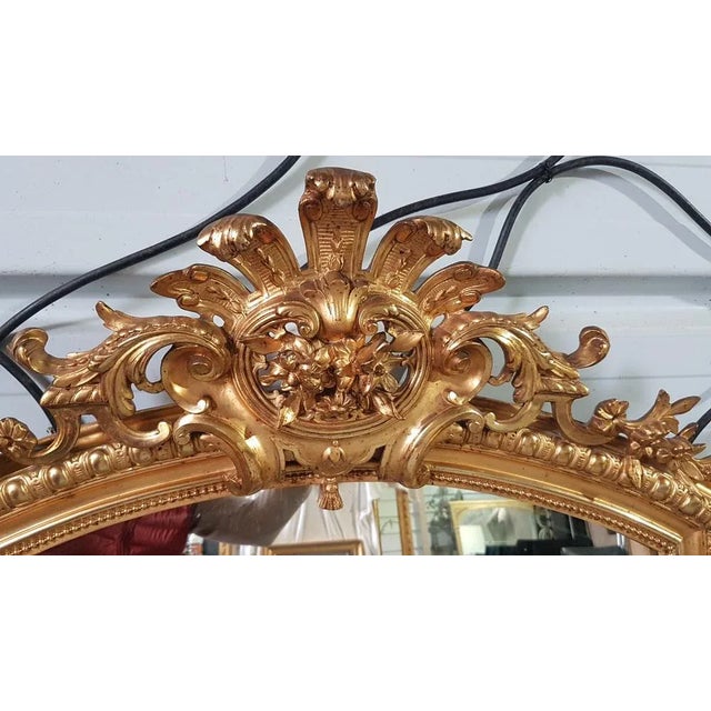 Mirror Napoleon III Dore with a leaf, pearl and ovals on the Pouour, louis XIV style pediment Large shell of Louis XV...