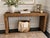 This console table is a beautifully crafted piece made from handwoven rattan by skilled artisans. This sturdy console adds...