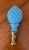 Hobnail pattern opaque blue glass finial attached to a polished brass base. It is about 8.25" tall. Original 2 mold marks...