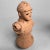 A unique vintage terracotta sculpture of a Japanese warrior, inspired by traditional haniwa figures from the Kofun period....