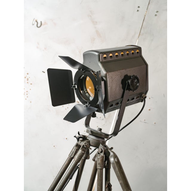 A belgian studio spotlight by adb, ets a. Backer s.a., produced in the 1960s and mounted on a german army field tripod by...