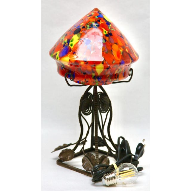 The 1930s, brlgium a wonderful belgium art nouveau lamp. The stands are handmade in wrought iron with black finish patina...