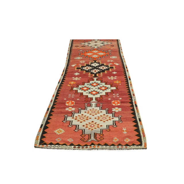 Decorative handwoven vintage kilim rug from Kars region of Turkey. Approximately 50-60 years old. In very good condition.