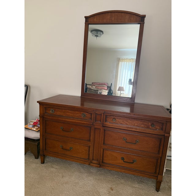 Mid Century modern dresser with matching mirror. It has 6 drawers and a hidden 7th small drawer space for valuables. Also...