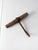 This antique ice hook features a weathered wood handle paired with a beautifully aged iron surface, showcasing the honest...