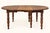 A majestic Louis-Philippe style solid oak dining table dating from the 19th century. Its circular top extends thanks to a...