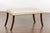 An English Regency bench from the 19th century with four saber legs and new custom linen upholstery with brass nailhead...