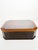 Elegant large lacquered decorative box from 1970s France, featuring a sophisticated combination of deep black and warm...
