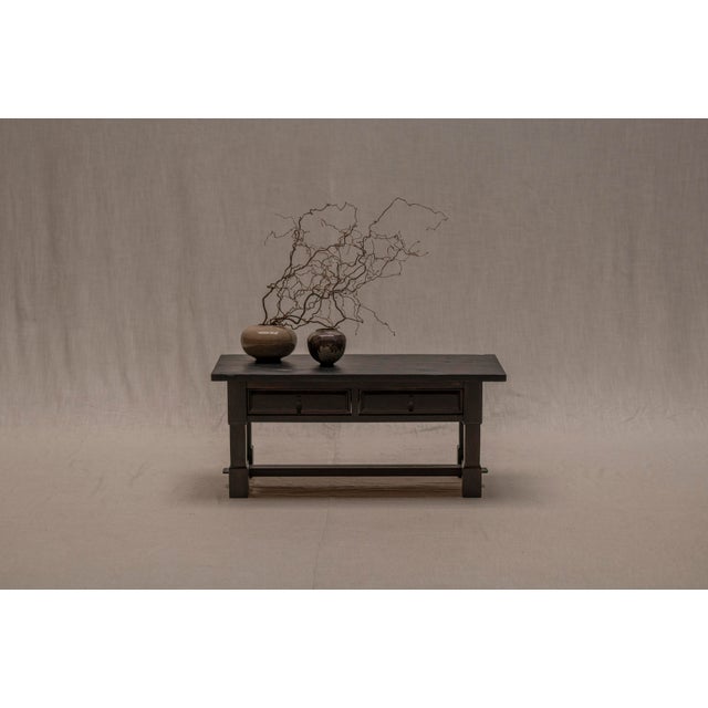 A striking and compact French Brutalist piece from the 1960s, crafted in solid oak and finished in a deep black stain....