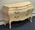 Beautifully crafted in Italy, this exquisite bombe chest features graceful curves, ornate Rococo-inspired detailing, and a...