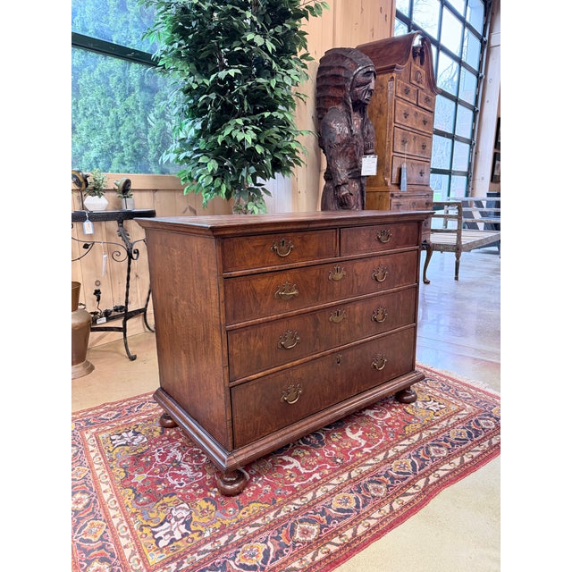 An exceptional early 19th century English two over three chest of drawers, showcasing the refined balance and proportion...