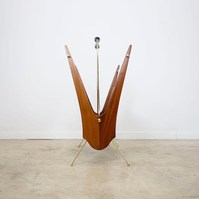 We offer this Rare Atomic Age Magazine Rack made in cedar wood and brass details, recently restored and the bronze pieces...